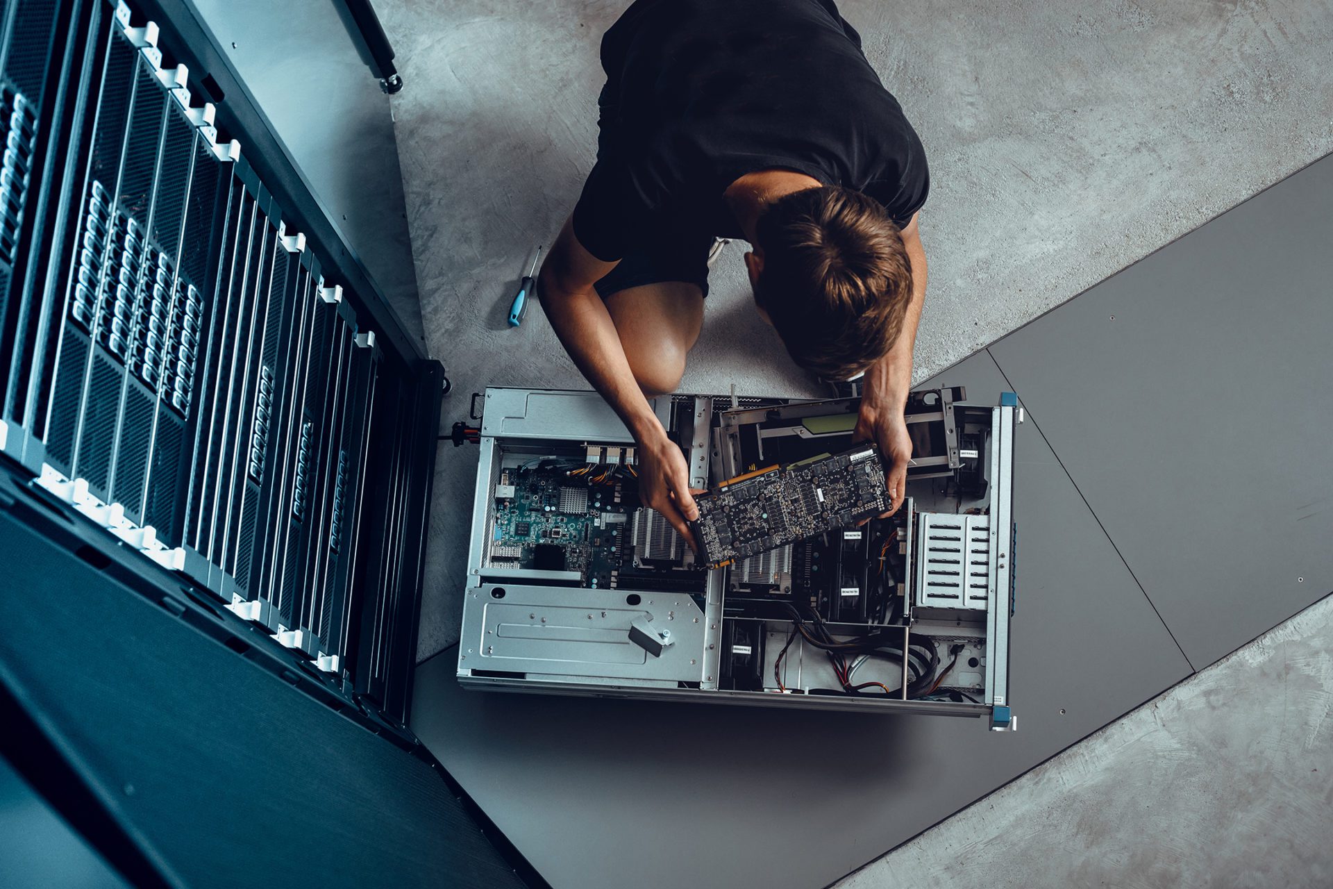 Image if man repairing a computer server