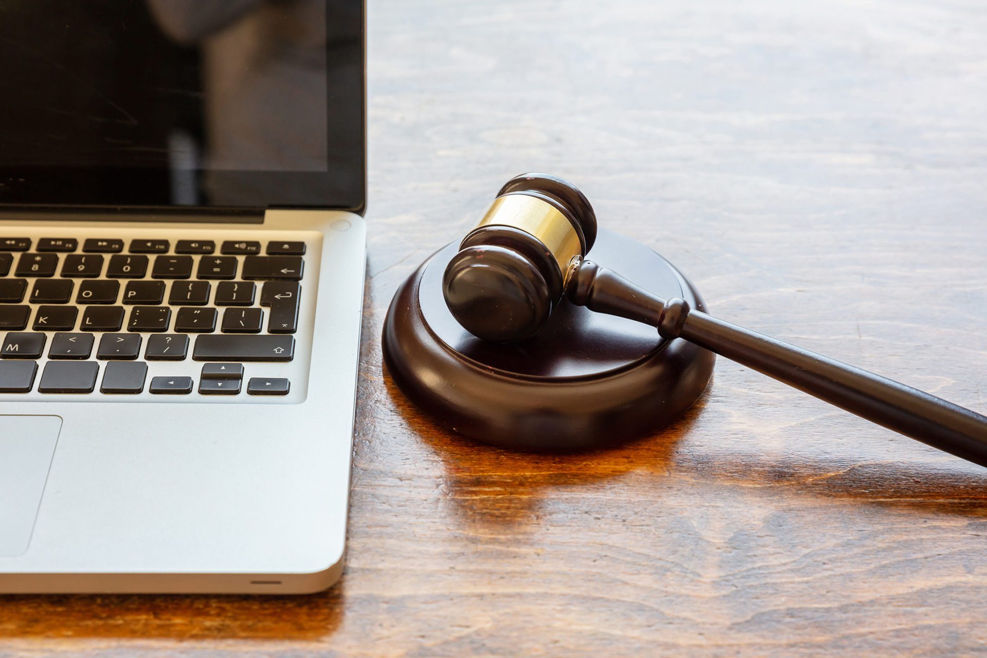 Image of a laptop and a gavel